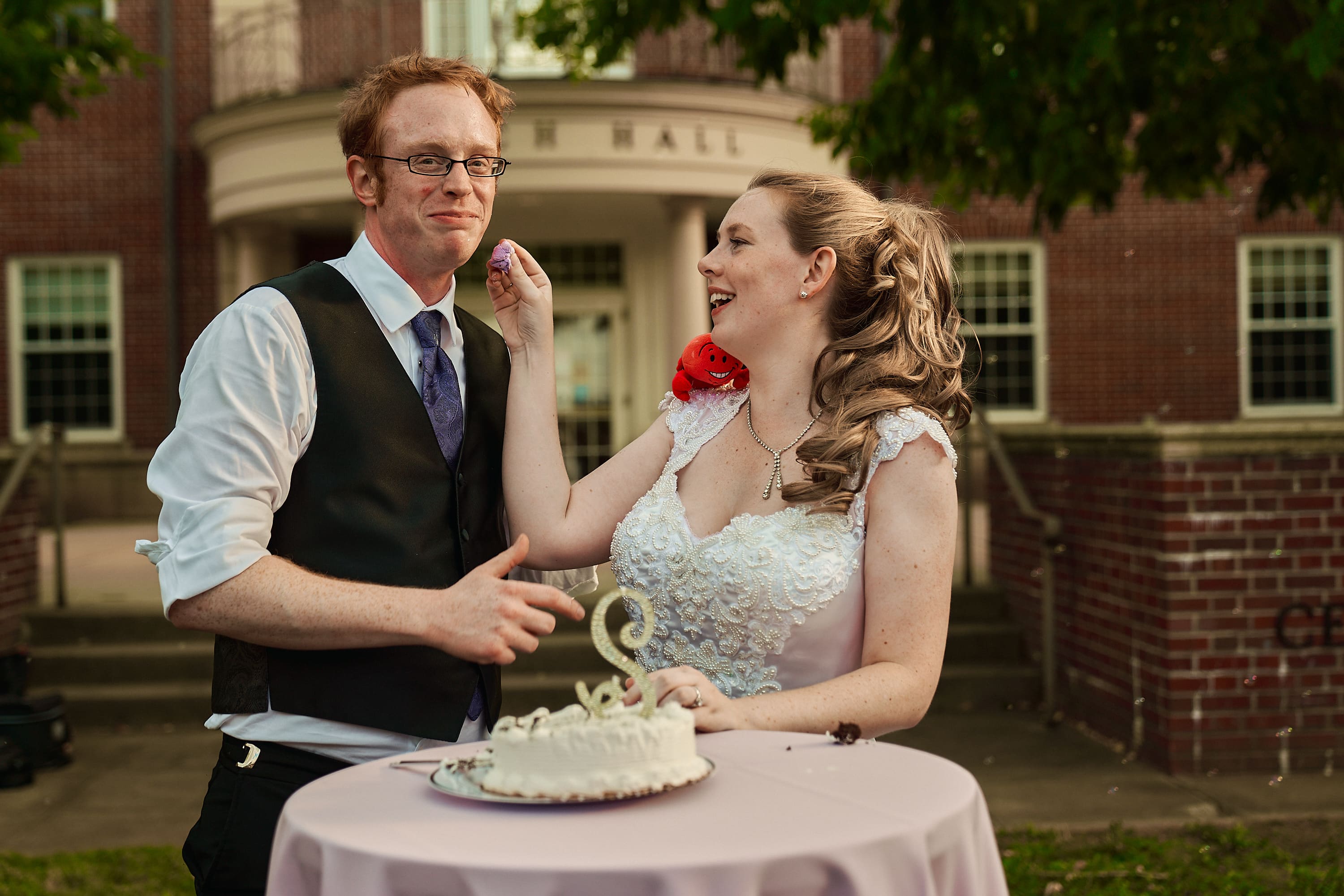 Candid wedding cake cutting ceremony at a Massachusetts venue